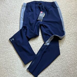 Women’s athletic pants. Water resistant.  Zippered leg opening.